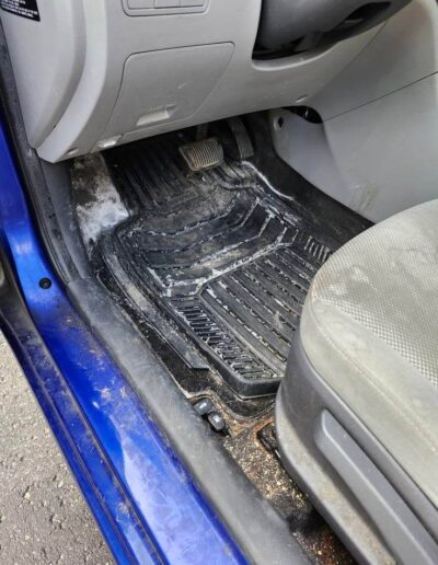 Before - dirty car mats, drivers area